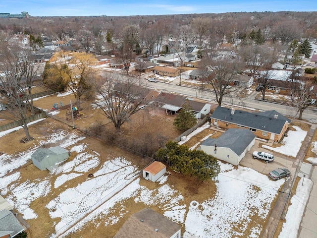 snowy aerial view featuring a residential view