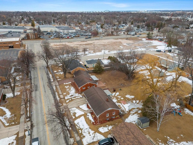 snowy aerial view with a residential view