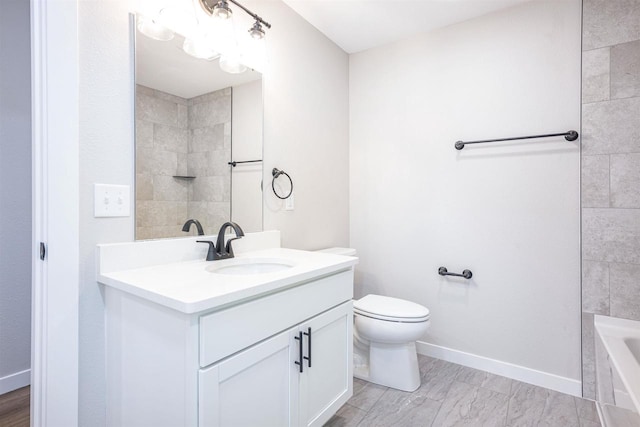 full bathroom featuring a tub to relax in, toilet, vanity, baseboards, and walk in shower