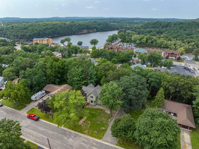 bird's eye view featuring a water view and a forest view