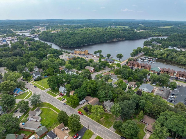 aerial view featuring a water view and a forest view