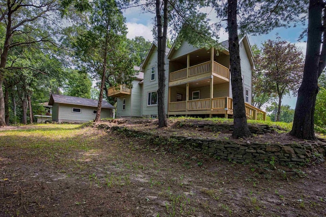 rear view of house featuring a balcony