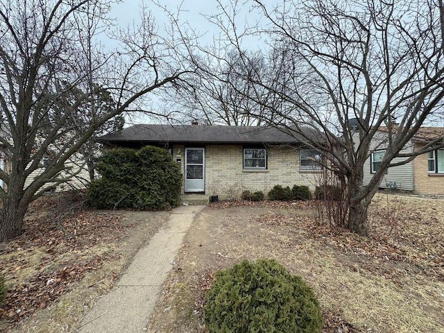 ranch-style house with brick siding