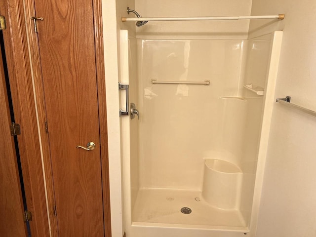 bathroom featuring a shower stall