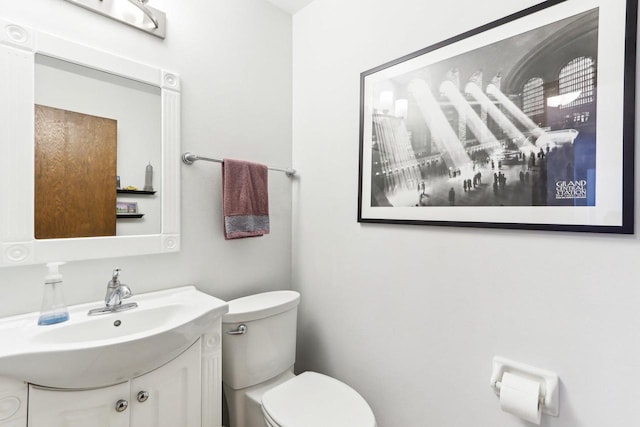 half bath with vanity and toilet