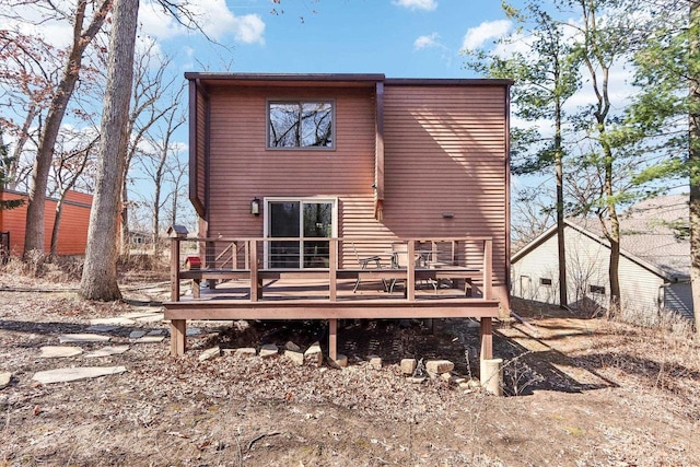 back of house featuring a wooden deck