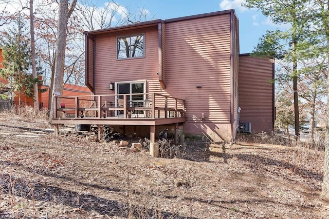 rear view of property featuring a deck