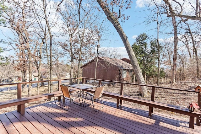 deck with outdoor dining area