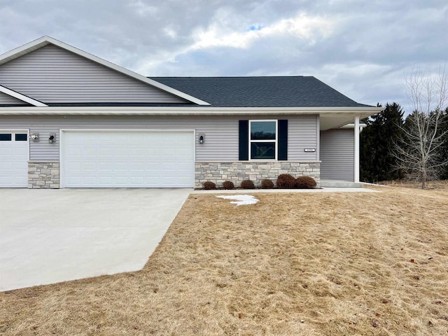 view of front of property featuring a garage, concrete driveway, stone siding, roof with shingles, and a porch