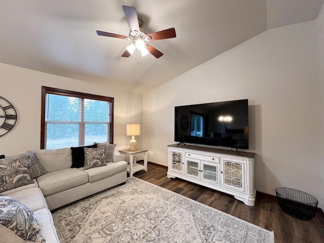 living room featuring a ceiling fan, lofted ceiling, dark wood-style flooring, and baseboards