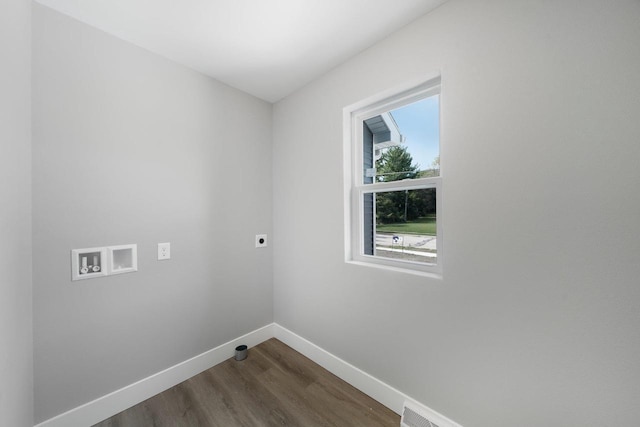 clothes washing area with washer hookup, dark wood finished floors, hookup for an electric dryer, laundry area, and baseboards