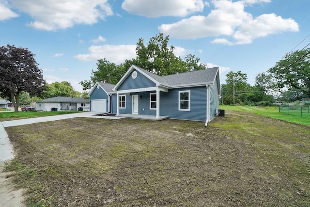 view of front of property featuring central AC, a porch, and a front yard