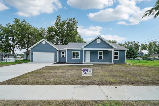 single story home featuring an attached garage, covered porch, fence, driveway, and a front lawn