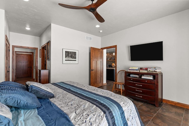 bedroom with ceiling fan, recessed lighting, visible vents, baseboards, and stone finish floor