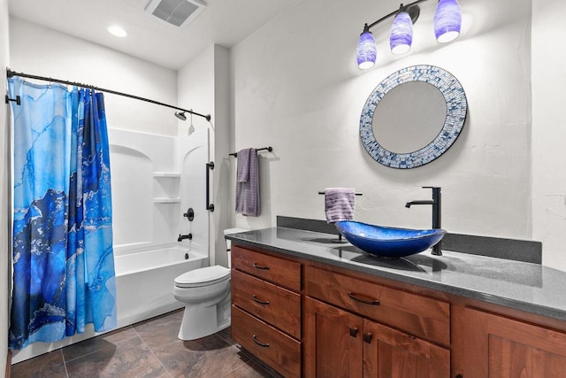 bathroom featuring toilet, vanity, visible vents, and shower / bathtub combination with curtain