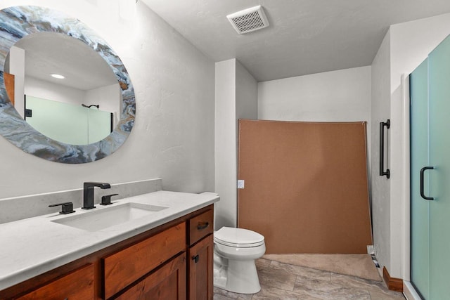 full bath with toilet, vanity, a shower stall, and visible vents