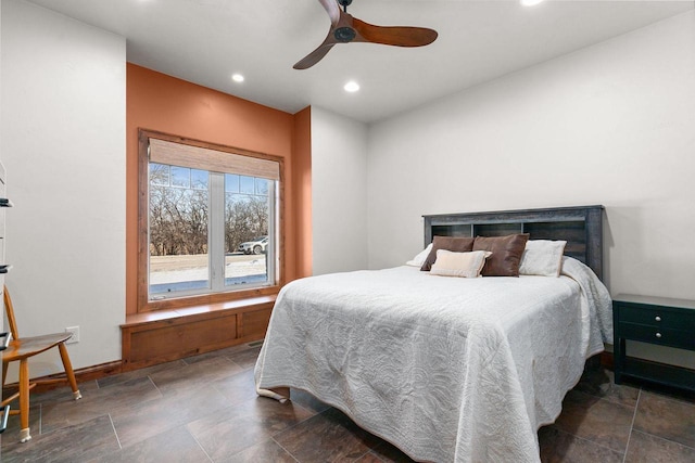 bedroom with baseboards, ceiling fan, stone finish floor, and recessed lighting