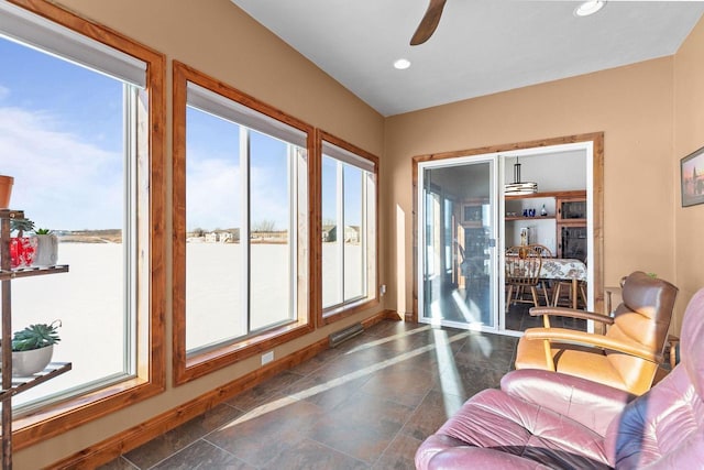 interior space featuring visible vents and a ceiling fan