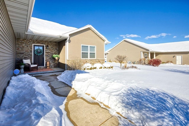 exterior space featuring stone siding