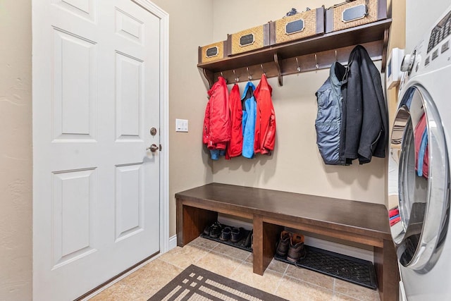 mudroom featuring washer / clothes dryer and baseboards