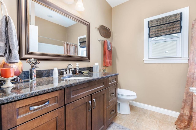 full bathroom with a shower with shower curtain, toilet, vanity, baseboards, and tile patterned floors