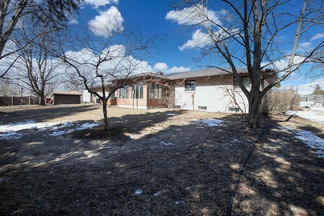 view of front of house with an outbuilding