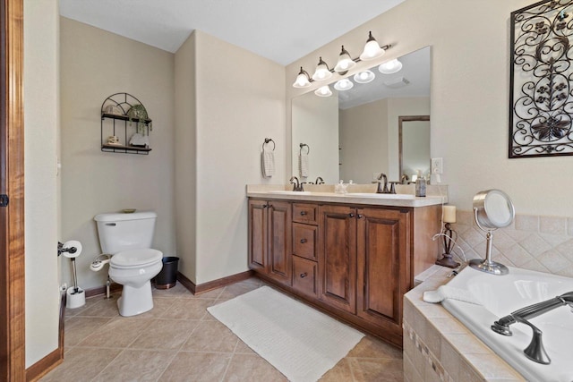 full bathroom featuring a relaxing tiled tub, double vanity, toilet, tile patterned floors, and a sink