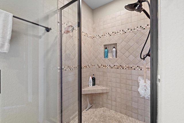 bathroom featuring a shower stall