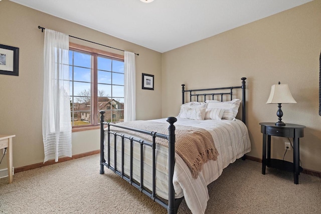 bedroom featuring carpet floors and baseboards