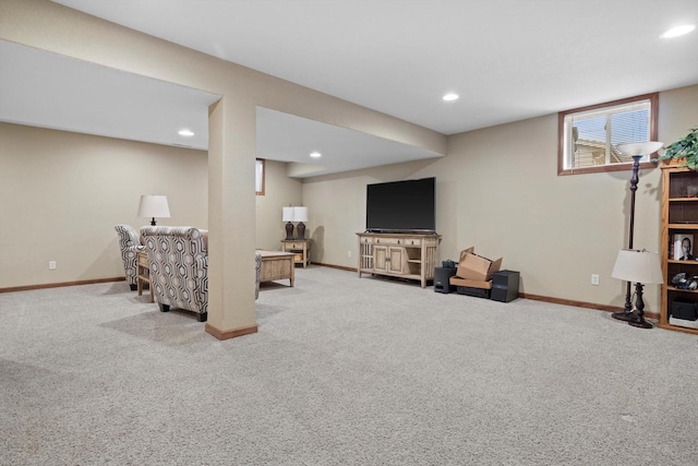 carpeted living room featuring baseboards and recessed lighting