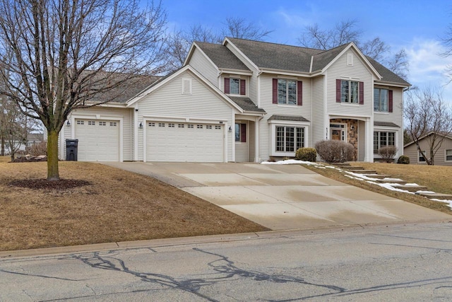 traditional-style home with a garage and driveway