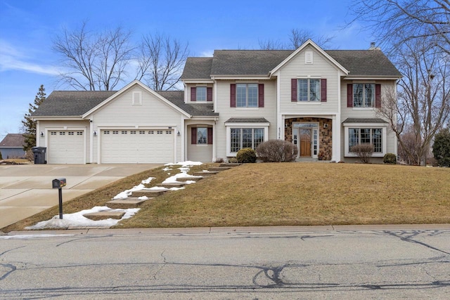 traditional home with a shingled roof, a front yard, concrete driveway, and an attached garage