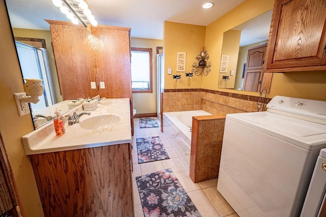 full bathroom featuring tile patterned floors, a sink, a shower stall, and a bath