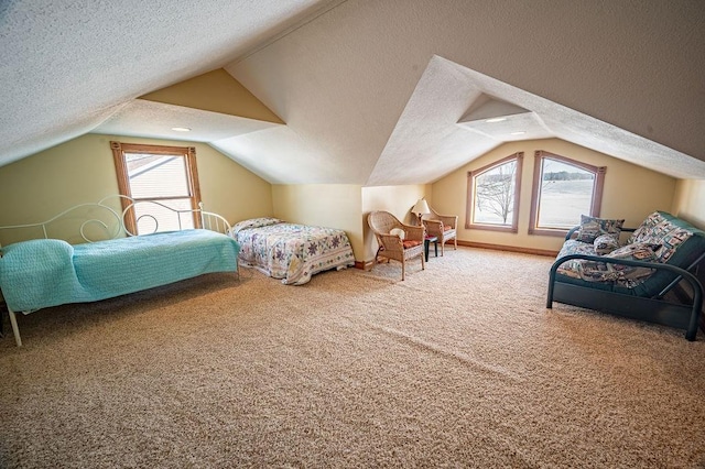 bedroom with lofted ceiling, carpet, and a textured ceiling