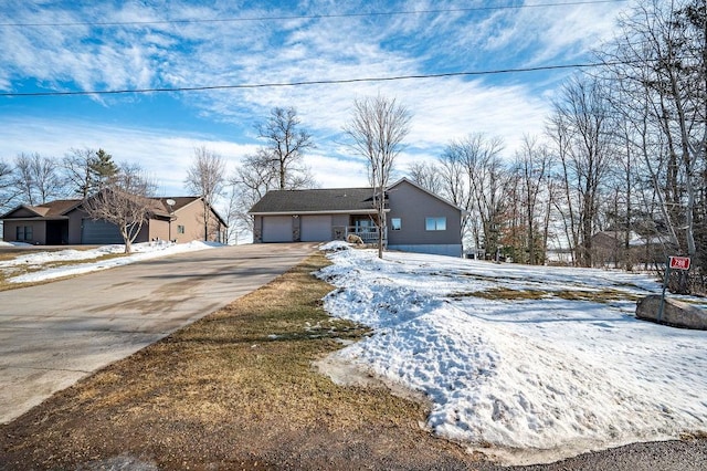 view of front of home with a garage and concrete driveway