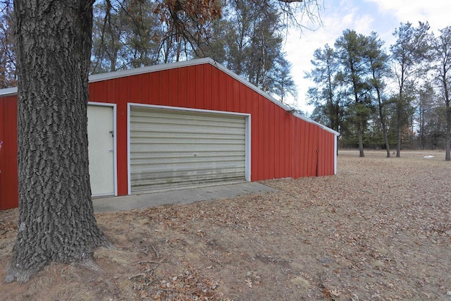 detached garage featuring driveway