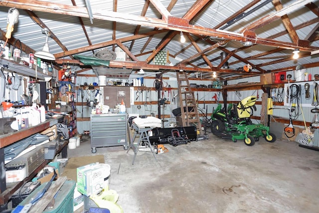 garage with metal wall and a workshop area