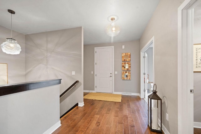 entrance foyer with hardwood / wood-style flooring and baseboards