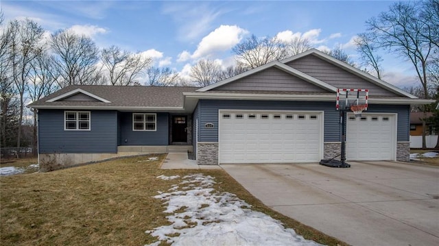 ranch-style home with a garage, stone siding, and concrete driveway