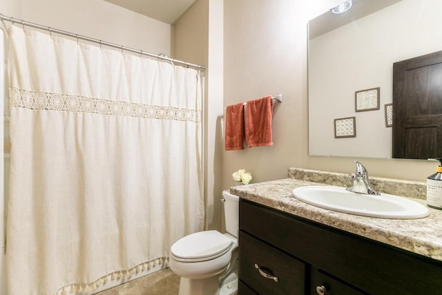 full bath featuring tile patterned flooring, vanity, and toilet