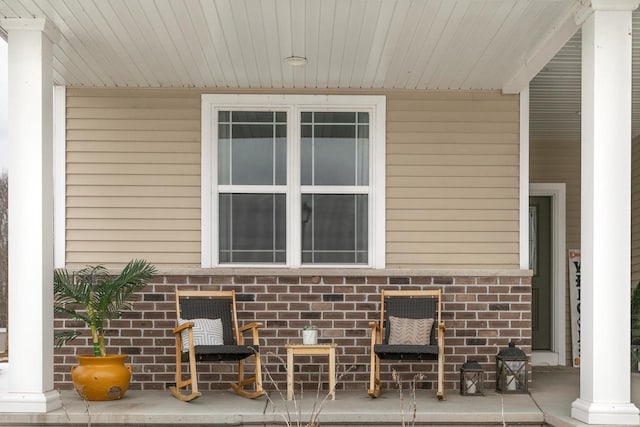 view of side of property with brick siding