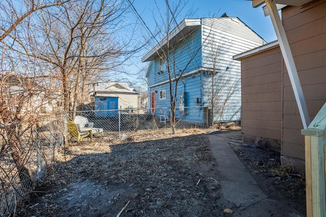 view of home's exterior with fence