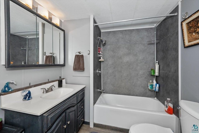 full bath featuring washtub / shower combination, vanity, and toilet