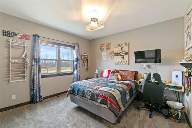 carpeted bedroom with baseboards