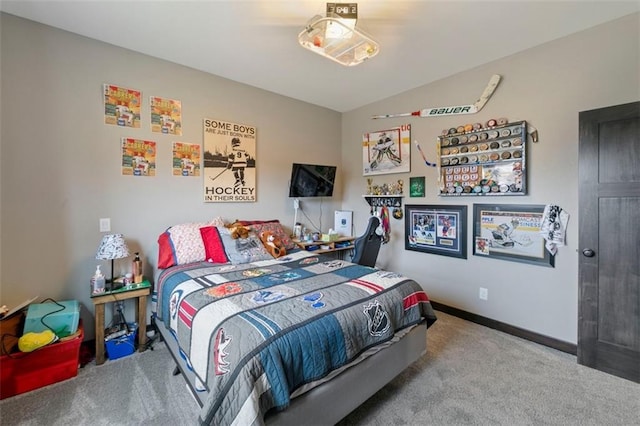 bedroom with vaulted ceiling, carpet, and baseboards