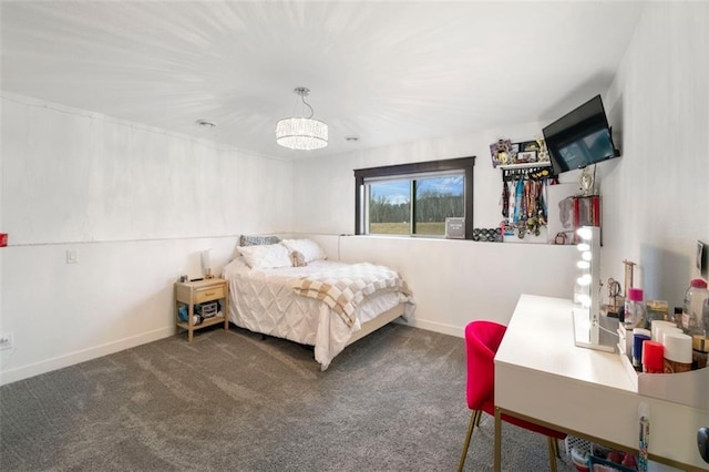 bedroom featuring carpet flooring and baseboards