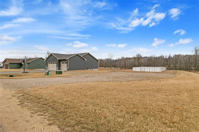 view of yard featuring a garage