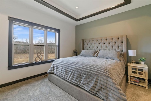 bedroom with recessed lighting, carpet, a raised ceiling, and baseboards