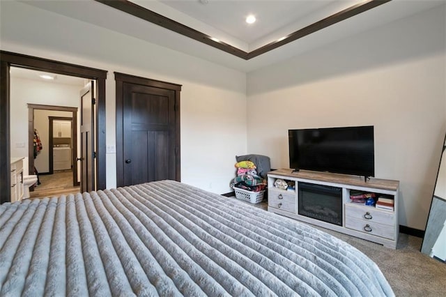 bedroom featuring washer / dryer, carpet, baseboards, and recessed lighting