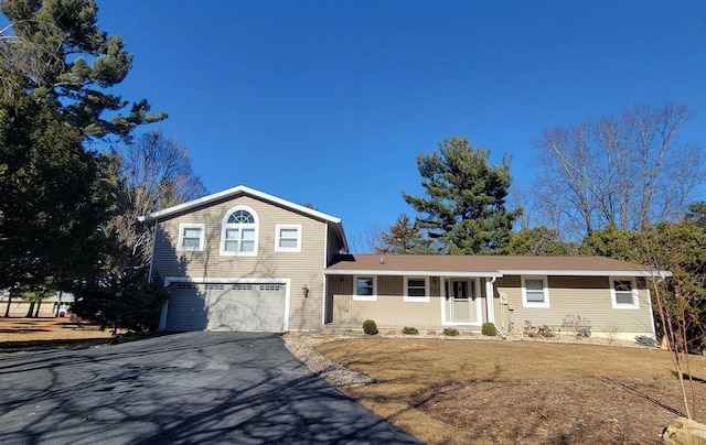 tri-level home featuring driveway and an attached garage